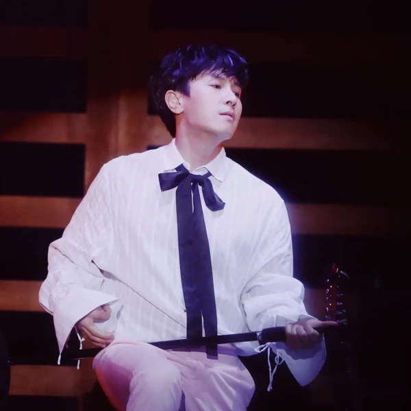 Signature photo of Kim Dongwan (SHINHWA) capturing their charm